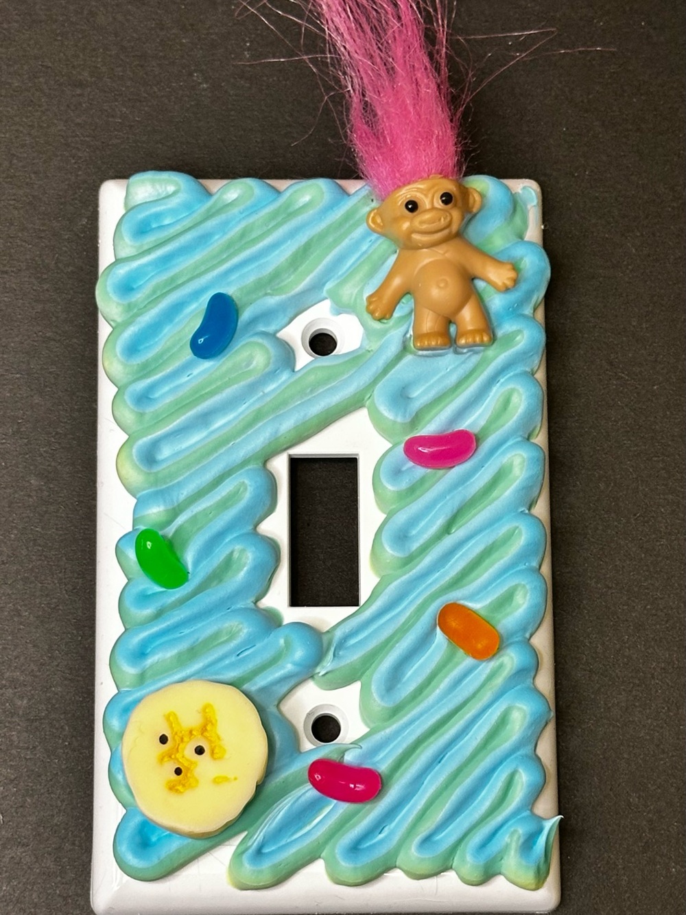 Decorative Blue Swirl Light Switch Cover with Pink-Head Troll Accent